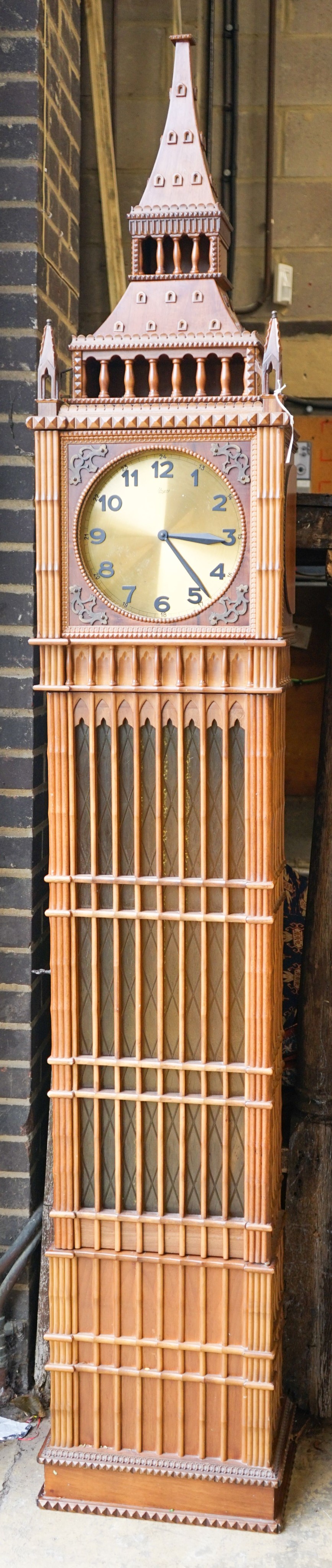 A mid 20th century architectural longcase clock, dial marked, 'Urgos', height 248cm